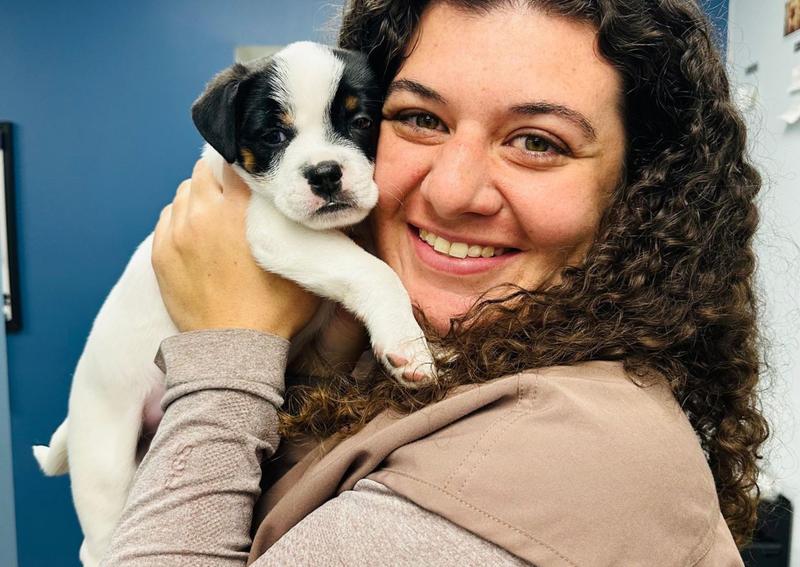 Carousel Slide 2: Dr. Viglietta and foster puppy